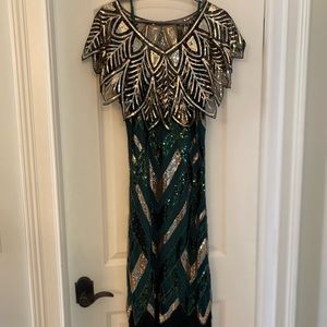 1920s era dress with capelet and headpiece